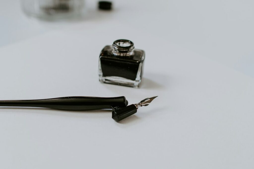 Dip pen holder beside ink
