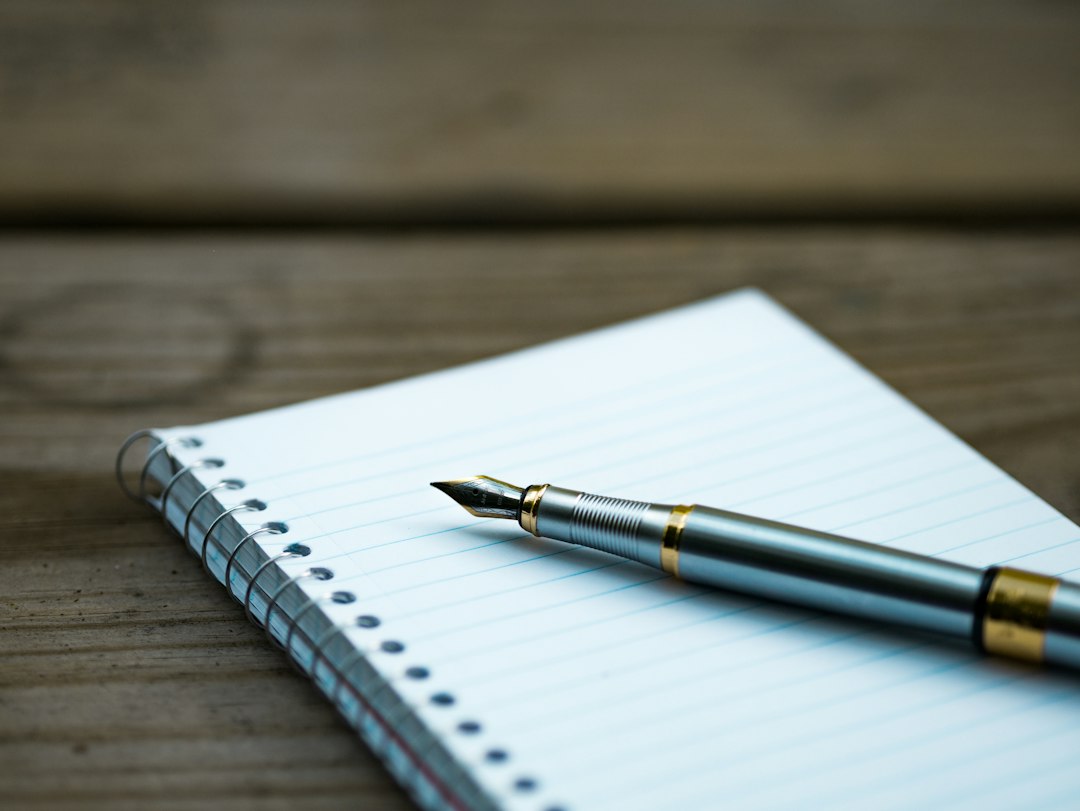 Notebook and writing instrument illustrating paper selection, not a product comparison photo