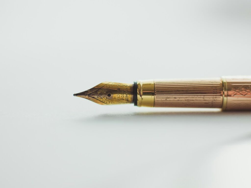 Fountain pen and writing stationery on a desk