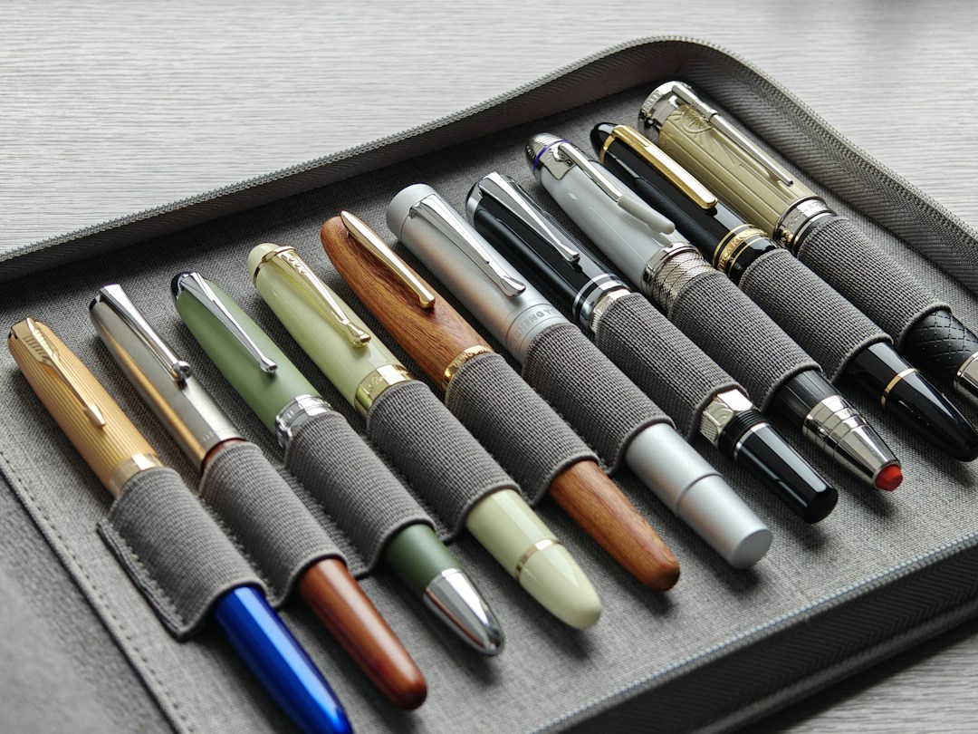 Fountain pens photographed on a writing desk; illustrative photograph, not a product test