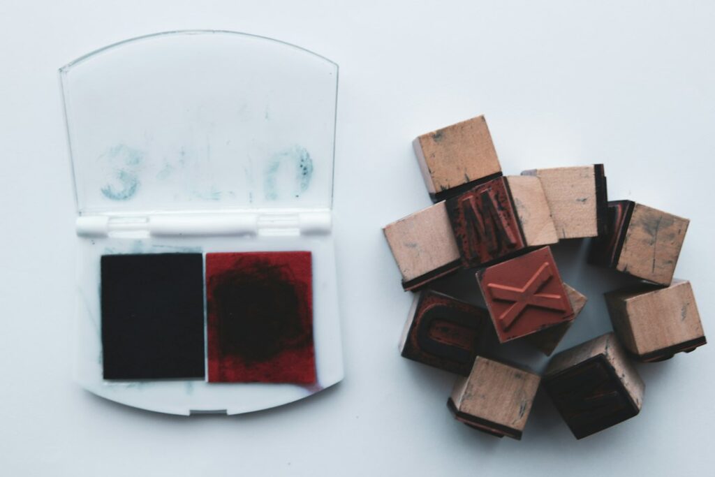 Rubber stamp and ink pad illustration, not a specific manufacturer product