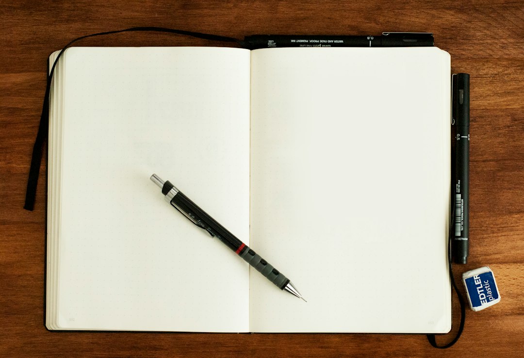 Open notebook with blank pages on a desk