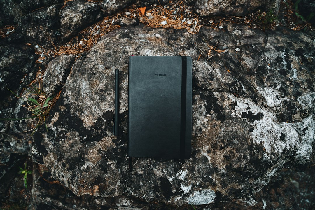 Notebooks arranged as an illustration of pocket note-taking; not actual waterproof product models
