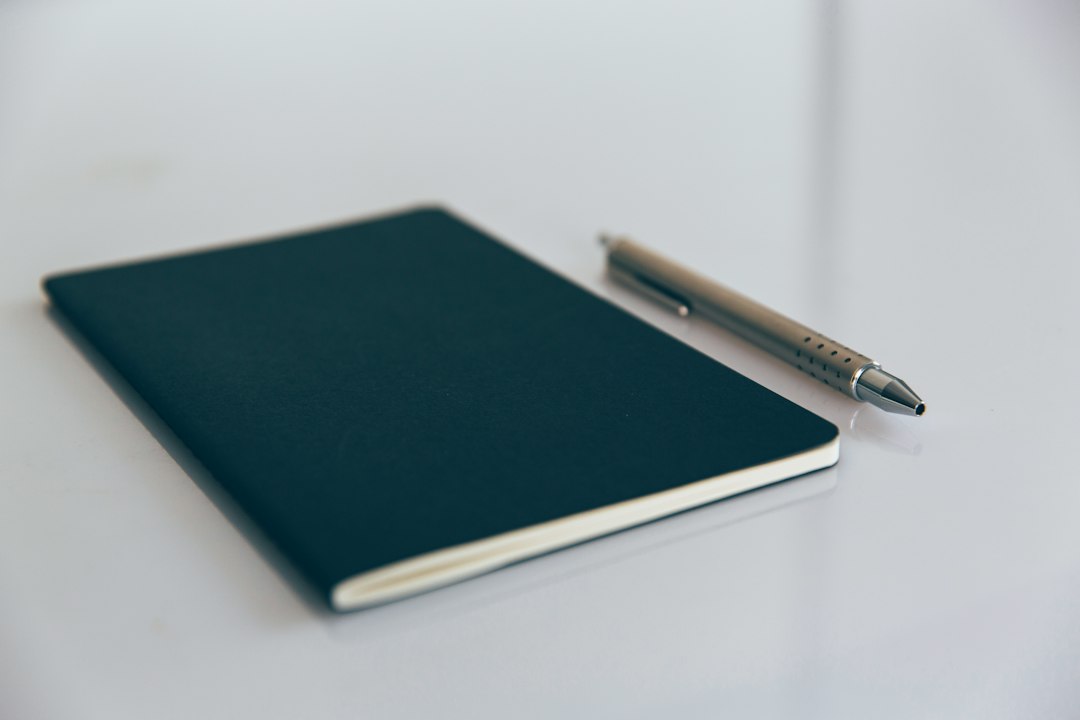 Notebook with writing instrument, illustrating notebook accessories rather than a pen-loop product