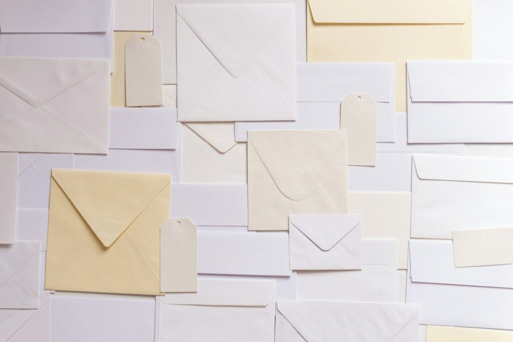 Paper stationery envelopes illustrating craft adhesive use
