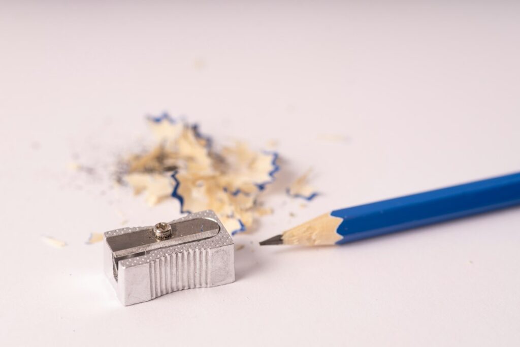 Pencil sharpener with pencils on a work surface