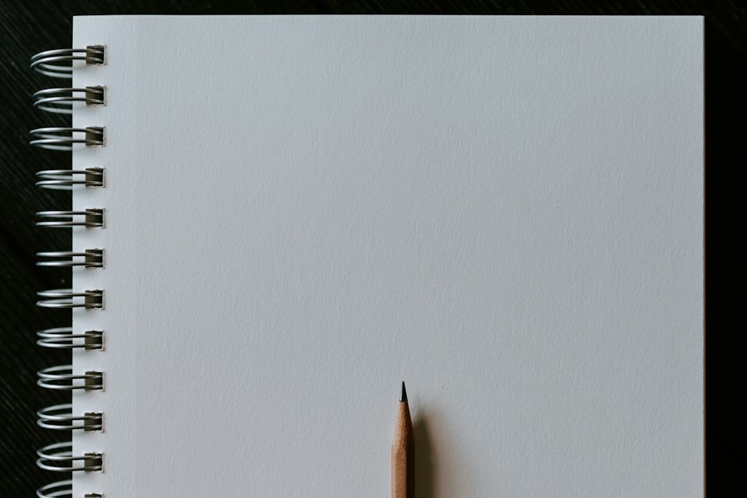 Pencil resting on a sketchbook