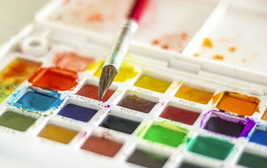 Tray of watercolour paints with brush
