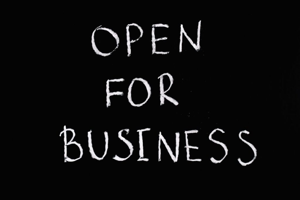 Chalkboard sign with bright white lettering