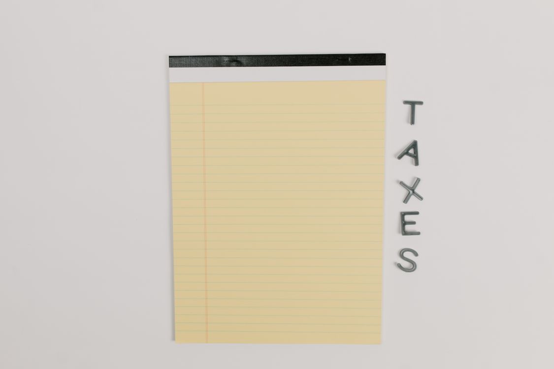 Yellow legal pad on a clean white surface