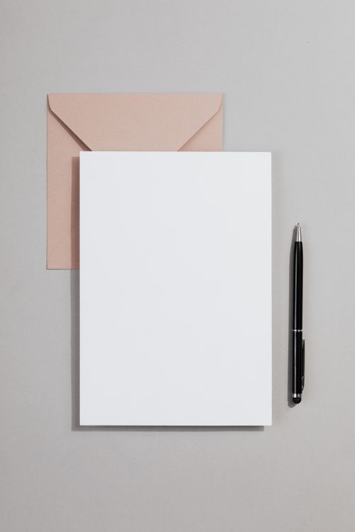Minimalist stationery set with envelope, writing paper, and pen