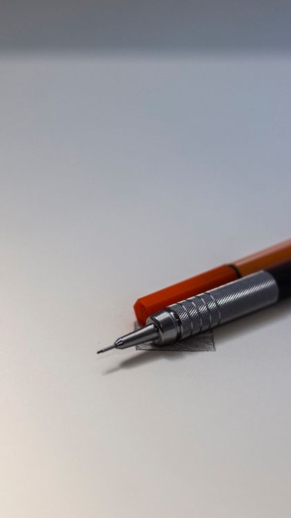 Close-up of a mechanical pencil on a writing surface