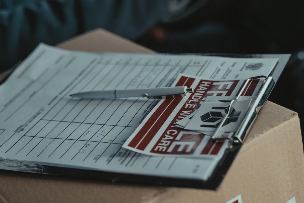 Shipping paperwork and labels arranged on a package for order fulfillment
