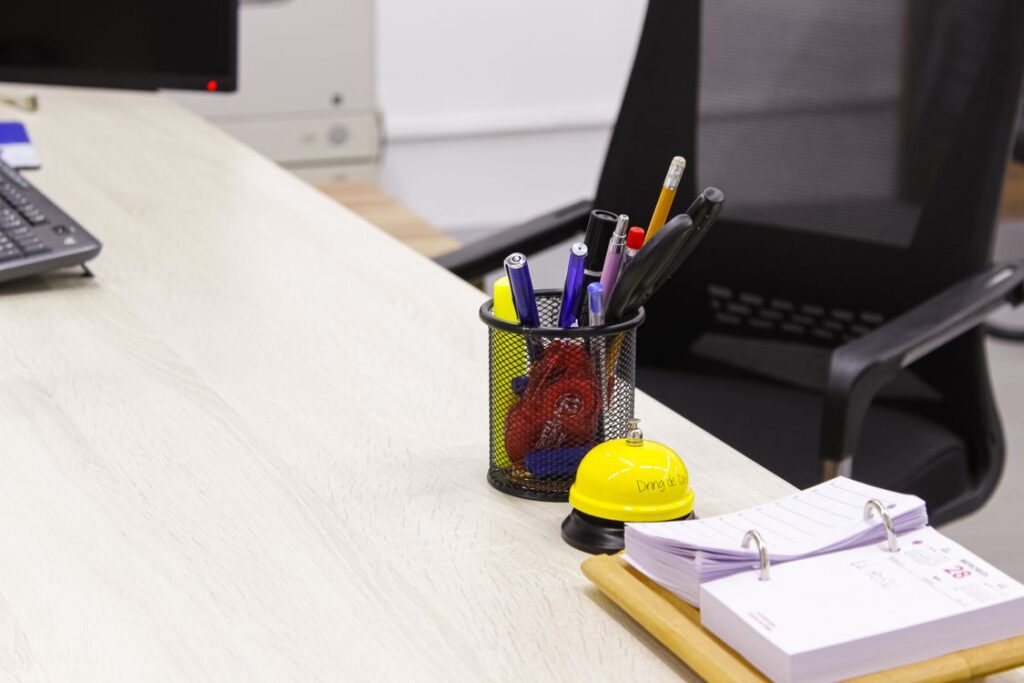 Tidy office desk with a pen holder and supplies