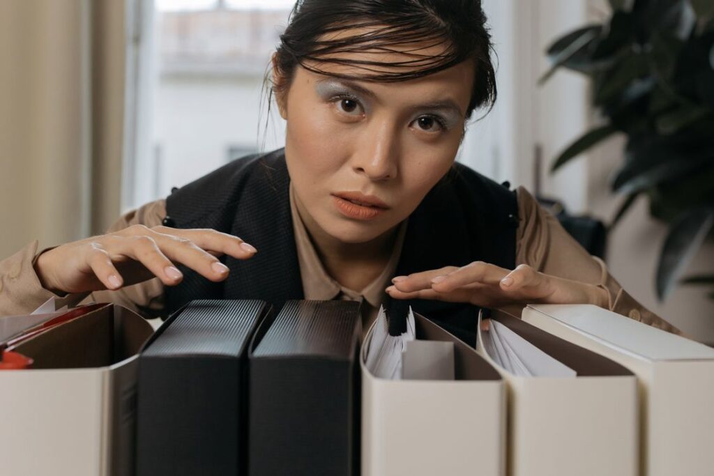 Woman organizing file folders in an office