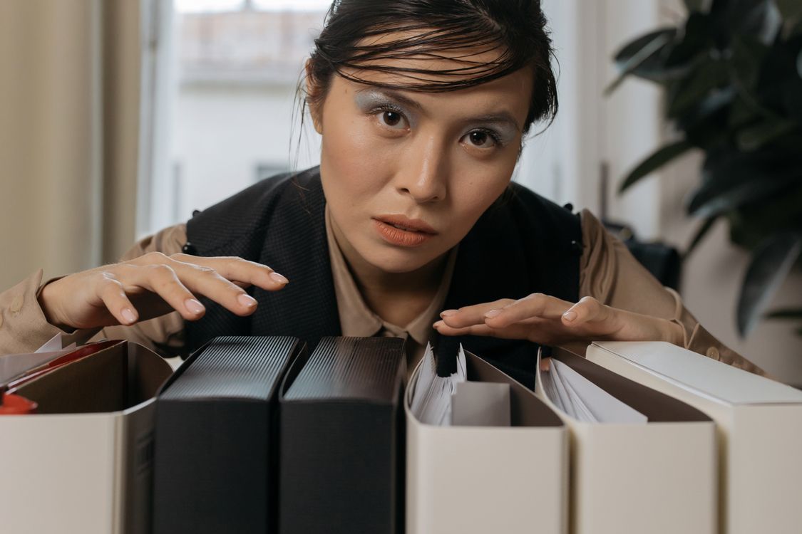 Woman organizing file folders in an office