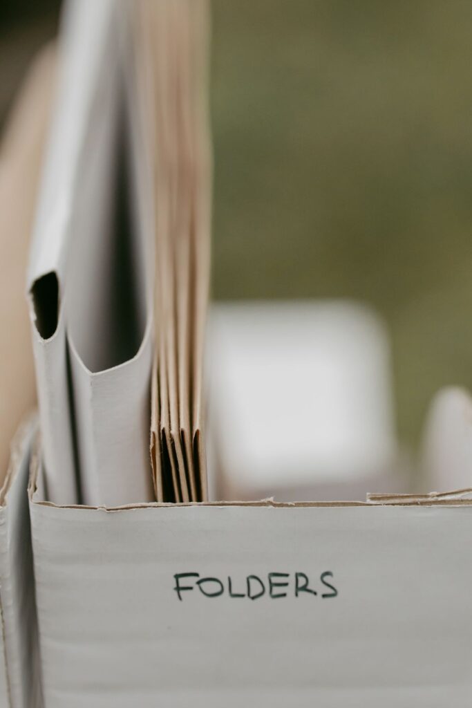 Close-up of neatly arranged document folders in an office storage box